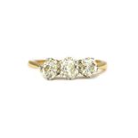 A gold and diamond three stone ring,