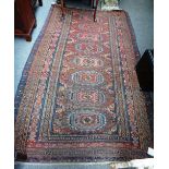 A Soumac carpet, Caucasian, the flatweave madder field with eight medallions, minor motifs,