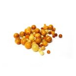 A single row necklace of dark honey coloured spherical graduated amber beads, length 37.
