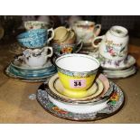 A quantity of ceramic trios and cup and saucer sets.