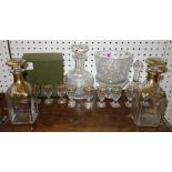 Two gilt glass decanters and glasses, and an Edinburgh glass decanter and stopper.