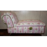 A miniature upholstered lift top chaise longue.