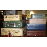 A group of eight 20th century vintage suitcases.