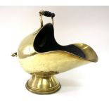 A Victorian brass helmet coal scuttle, with turned ebonised handles 48cm across.