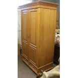 A reproduction mid 19th century style pine wardrobe,