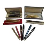 A 9ct gold ball point pen with twist mechanism (13cm), a Parker Vacumatic fountain pen,