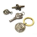 A Victorian silver baby's rattle cum whistle, fitted with four bells, (the teether lacking),