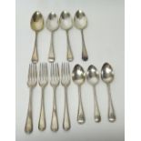 Silver bead edged Old English pattern table flatware, comprising; four dessert spoons, mixed dates,