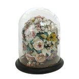 A polychrome painted shell ornament, late 19th century, modelled as still life flowers,