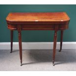 A Regency mahogany foldover card table, on tapering reeded supports, 91cm wide x 73cm high.