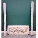 A 19th century white painted door surround, the upper frieze plaster relief with floral swags,