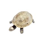 A silver mounted base metal table bell, modelled as a tortoise, the silver shell Chester 1909,