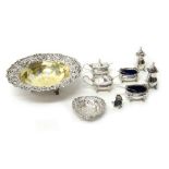 Silver, comprising; a three piece condiment set, London 1972, with two blue glass liners,
