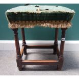 A William and Mary walnut framed upholstered stool, on turned supports,