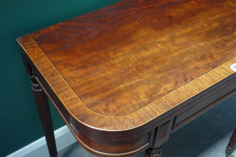 A Regency mahogany foldover card table, on tapering reeded supports, 91cm wide x 73cm high. - Image 2 of 3