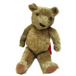 A Chad Valley 'Hygienic' toy teddy bear, with golden fur, growler, and jointed limbs, 50cm high.