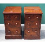 A pair of figured walnut three drawer bedside tables, on plinth bases, each 32cm wide x 57cm high,