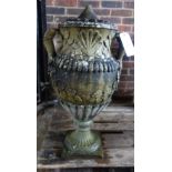 A pair of Neo-Classical Revival reconstituted stone twin handle urns on fluted socles,