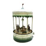 A German tinplate carousel, circa 1920, of circular form,