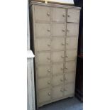 A grey painted locker unit with three rows of seven doors, 93cm wide x 197cm high.