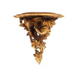 An early 20th century Rococo Revival gold painted acanthus scroll wall bracket,