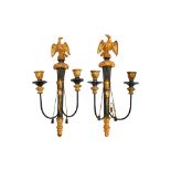 A pair of Regency style ebonised and giltwood two branch wall appliques, late 19th century,