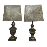 Two similar silvered carved wooden table lamps, each of foliate urn form,
