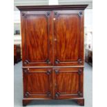 Possibly Gillows; a George III satinwood banded mahogany double height linen cupboard,