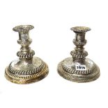 A pair of silver table candlesticks,