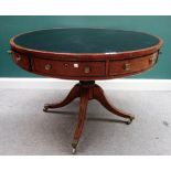 A George III gilt metal mounted hardwood drum table,