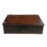 A 17th century and later oak slope front bible box, with carved front panel, 61cm wide x 38cm deep.