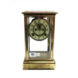 An Ansonia brass four glass mantel clock,