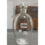 A Victorian silver mounted glass decanter, of flask form, the drop shaped glass body,