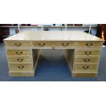 An 18th century style bleached oak partner's pedestal desk,