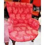 A red upholstered armchair possibly by George Smith.