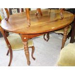 A 19th century French fruitwood oval kitchen table, on turned supports, 120cm wide x 94cm long.