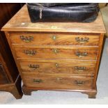 An early 19th century small mahogany chest of four long drawers, 65cm wide.