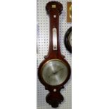 A Victorian walnut wheel barometer, with silver dial, 107cm high.