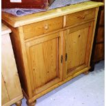 A 20th century pine dresser base, with pair of drawers and cupboards, 97cm wide.