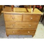 A 20th century pine chest of two short and two long drawers. 96cm wide.