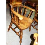 A pair of early 20th century beech framed tub back captain's chairs (2).