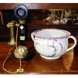 An early 20th century Bakelite and brass telephone,