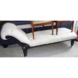 A Victorian ebonised chaise longue, on turned supports, 195cm wide.