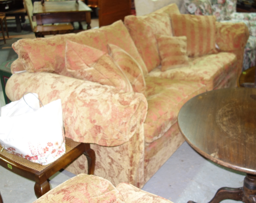 A large 20th century red and gold sofa and armchair.