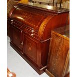 A late 19th century marquetry inlaid mahogany cylinder bureau,