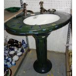 An early 20th century green and blue oval ceramic pedestal basin with chrome fixtures and fittings.