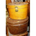 Two 20th century cylindrical metal boxes, possibly for hats.