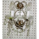 A pair of early 20th century metal and glass twin branch wall lights with glass drops.