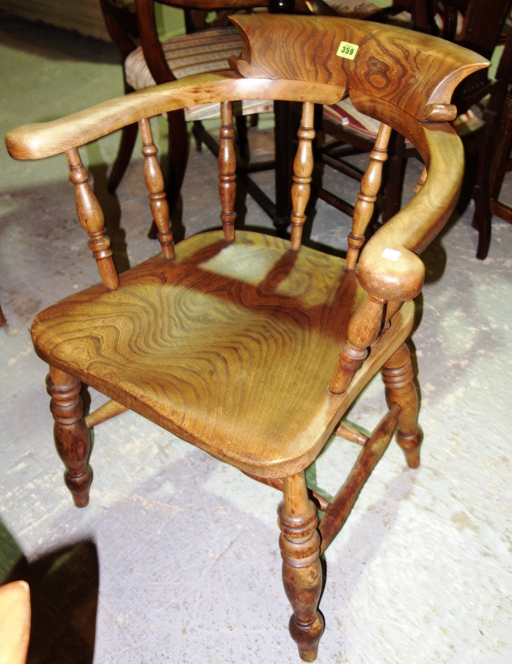 A Victorian bar back, elm seated captain's chair.