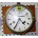 A brass cased porthole clock.